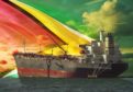 The oil tanker on the ocean with Guyana flag background; Shutterstock ID 1553276936; purchase_order: Energy Voice; job: To go with Brian Wilson column in EV supplement; 80b95484-4973-4158-a6ca-1c9cfeacaa48