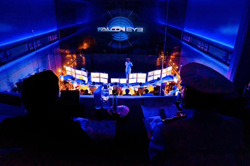 Falcon Eye projected on big screen in darkened room