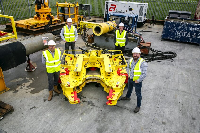 Decom Engineering 4: Pictured beside Decom Engineering’s new 24" Chopsaw (Left to right) Business Development Managers Scott Eke and Matthew Drumm; Commercial Director Nicholas McNally; CEO Sean Conway.