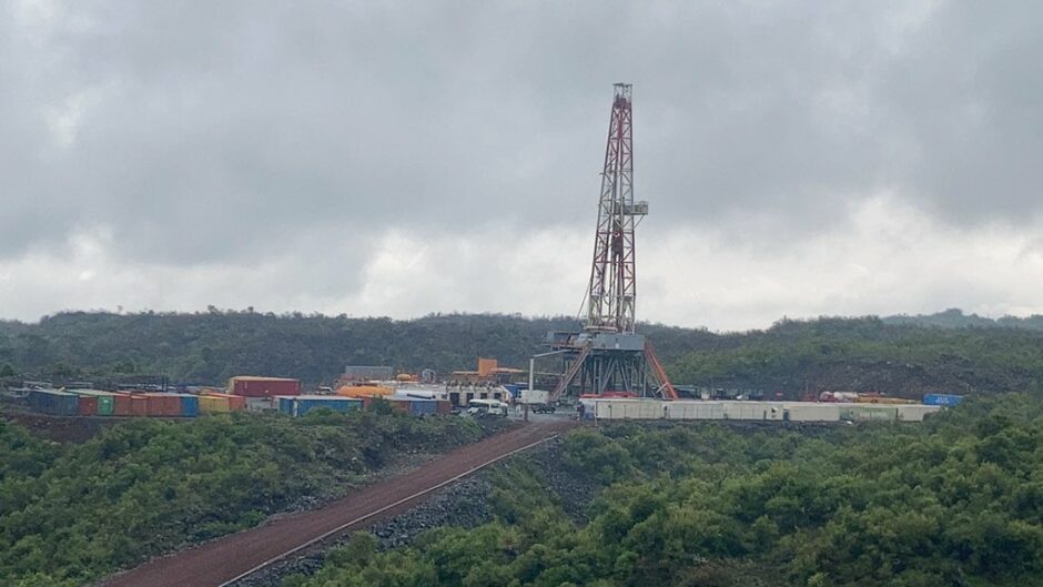 A drilling rig in a cloudy landscape