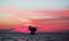 Offshore platform in Southeast Asia at sunset.