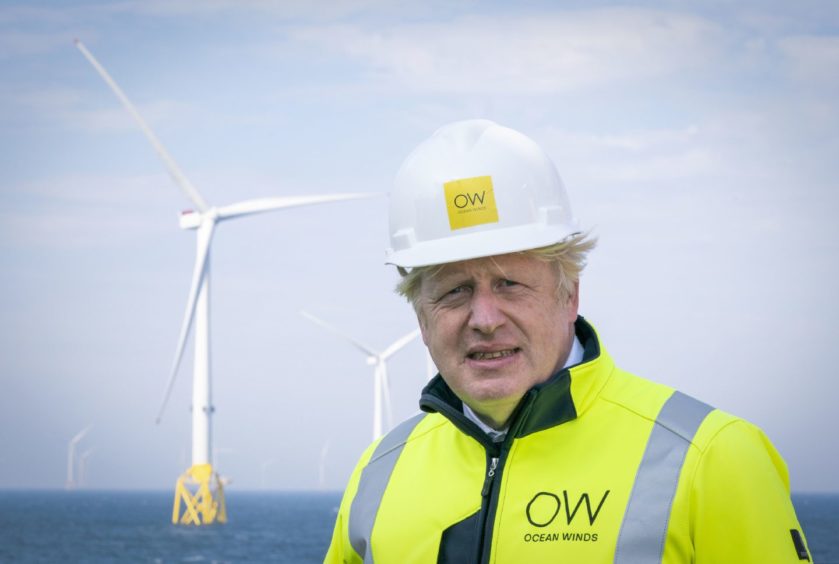 Prime Minister Boris Johnson onboard the Esvagt Alba during a visit to the Moray Offshore Windfarm East, off the Aberdeenshire coast. Picture date: Thursday August 5, 2021. Jane Barlow/PA Wire