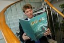 Bruce Dingwall photographed in 2003 holding a report by the UK Offshore Operators Association, of which he was president.