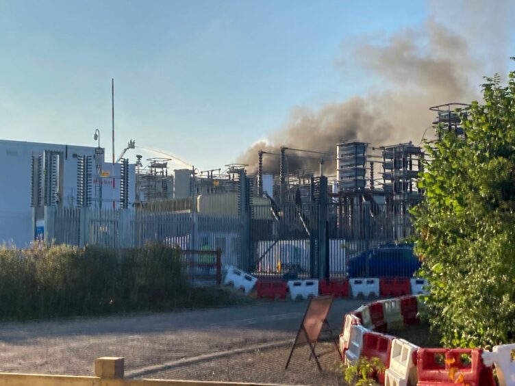 Smoke from a large fire at the National Grid Plc's IFA interconnector site in Sellindge, U.K., on Wednesday, Sept. 15, 2021. The fire at the key electricity converter station in the U.K., has shut down a major cable that brings power from France to Britain. Photographer: Edward Evans/Bloomberg