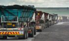 Coal delivery trucks queue at a weighbridge at the Goedehoop coal mine, operated by Anglo American Plc, in Mpumalanga, South Africa, on Tuesday, Jan. 12, 2021. Photographer: Waldo Swiegers/Bloomberg