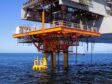 An orange oil platform in the sea