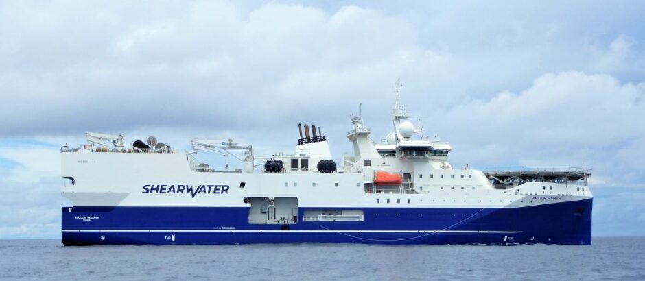 A blue and white boat in the sea