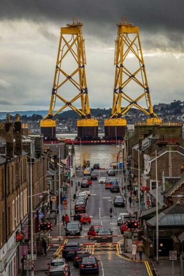 A barge shipping turbine jacket foundations for installation at the Seagreen Wind Farm passes Broughty Ferry.