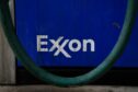 Signage at an Exxon Mobil Corp. gas station in Houston, Texas, U.S., on Wednesday, Oct. 28, 2020. Photographer: Callaghan O'Hare/Bloomberg