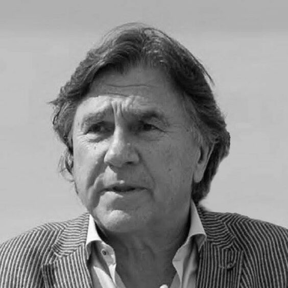 Black and white headshot of man with jacket