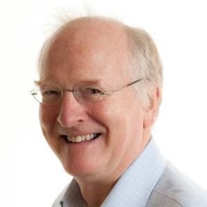 Headshot of man with glasses on white background