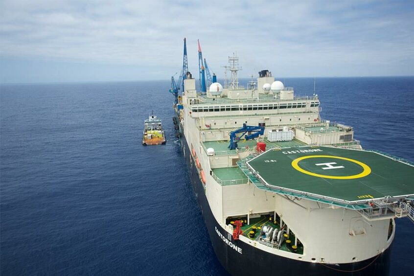 Big ship with helipad on blue sea