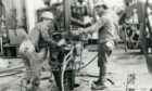 Historical photograph of workers at Erawan