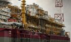Side view of FPSO, with yellow and red equipment