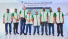 People in NNPC shirts stand in a line