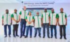 People in NNPC shirts stand in a line
