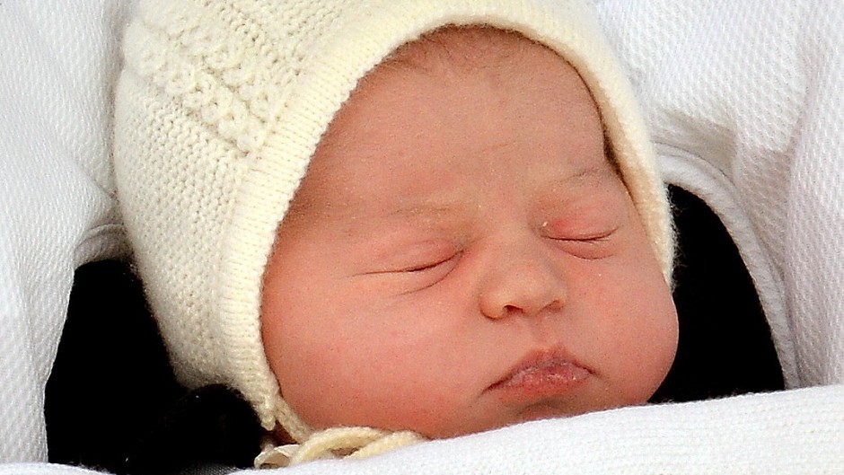 Princess Charlotte is carried by the Duke of Cambridge in a baby car seat outside the Lindo Wing of St Mary's Hospital in London
