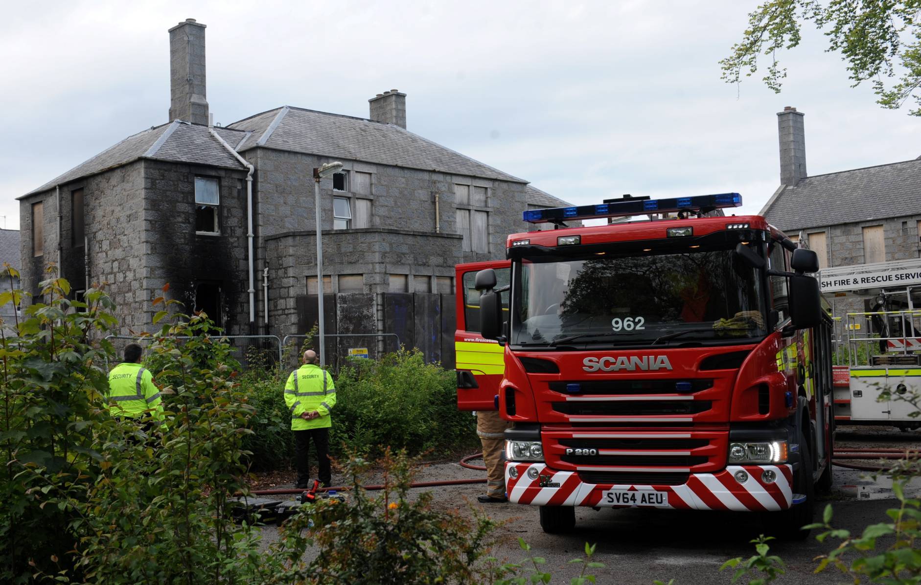 Firefighters at the scene of the blaze in an old section of Cornhill Hospital.