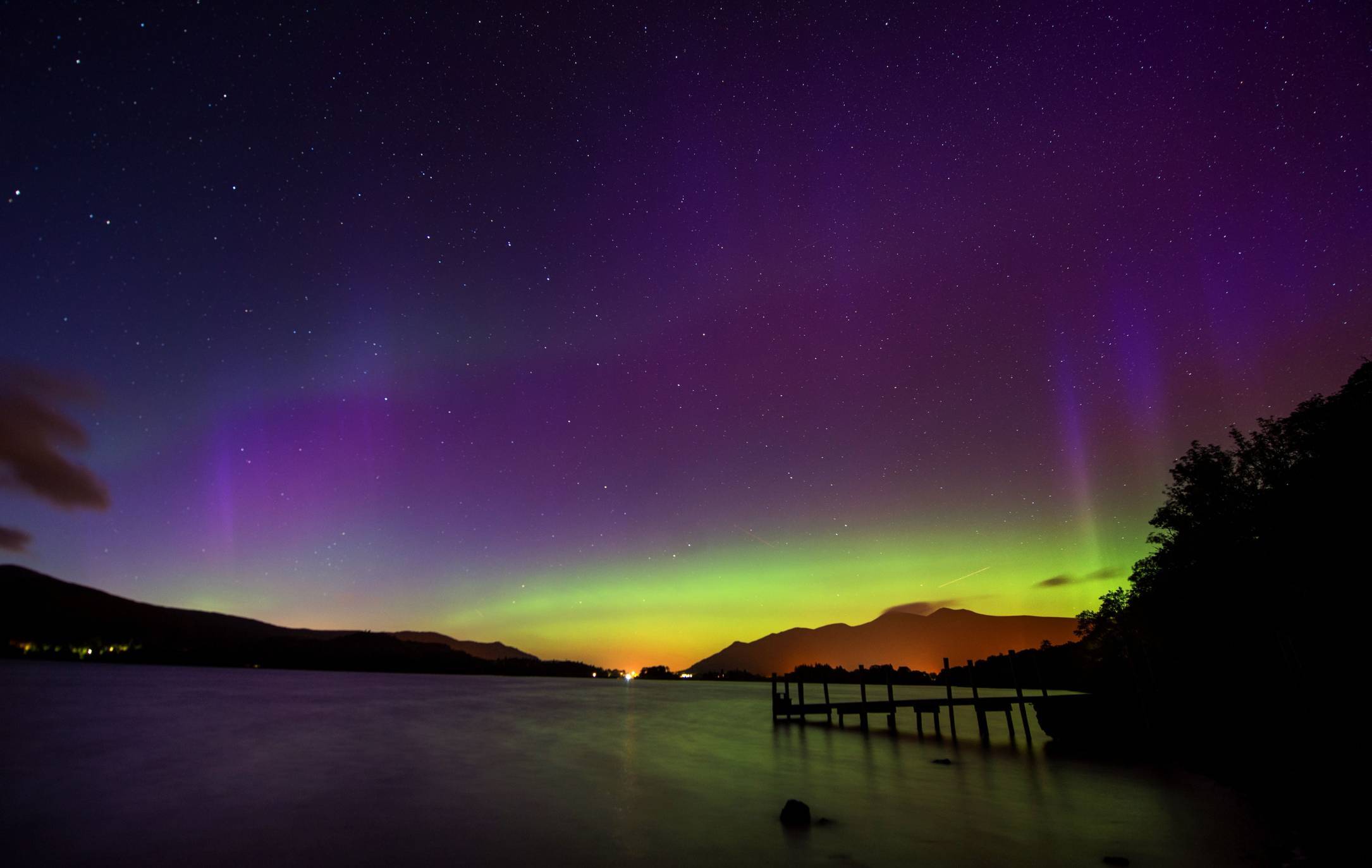 The Northern Lights, or Aurora Borealis, shine over Derwentwater.