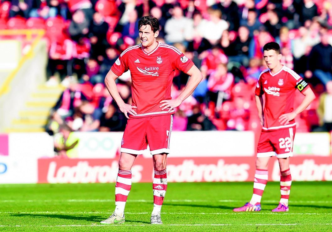 Ash Taylor and Ryan Jack find defeat hard to take at Pittodrie.