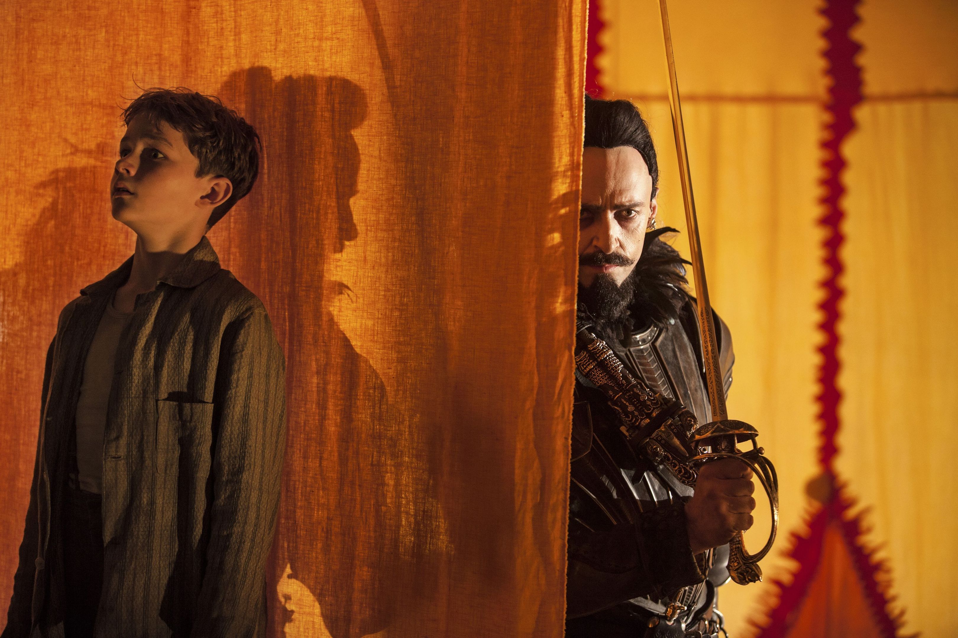 Peter Pan (Levi Miller) hides from Blackbeard (Hugh Jackman) in a scene from Pan.