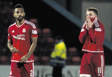 Jonny Hayes, right, and Shay Logan look stunned after the defeat at Ross County.
