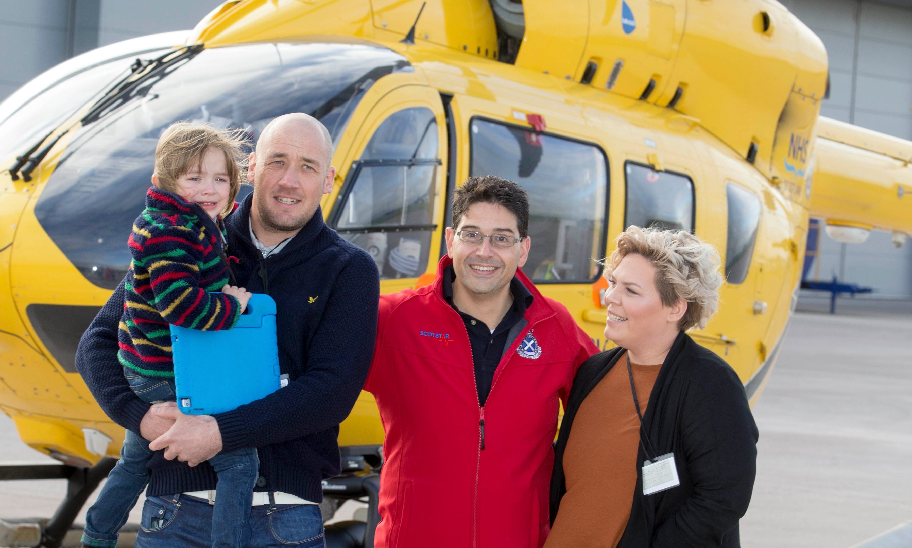 Four-year-old Mylo McLean with dad Craig, consultant Edgar Brincat and mum Lianne.