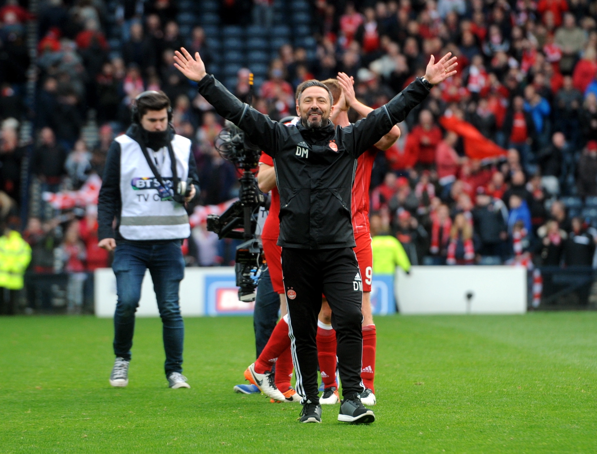 Derek McInnes celebrates at the final whistle.
