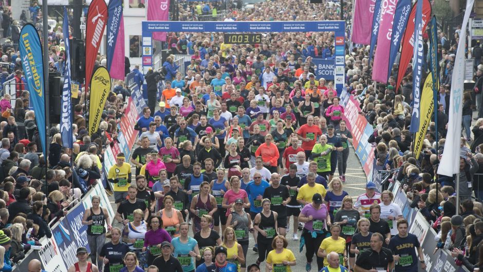 Runners leave George Square at the start of the 10k race at the Great Scottish Run in Glasgow