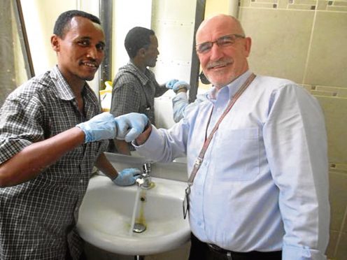 Gary Mortimer, right, with a hospital worker in Ethiopia.