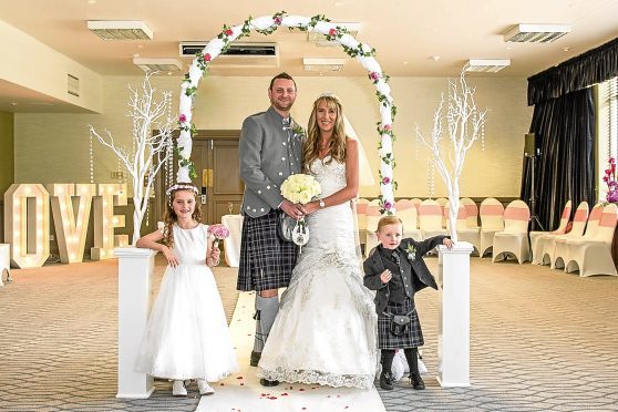 My quine Caroline with her husband Ritchie and children Callie and Jamie. Picture by LoveWeddings