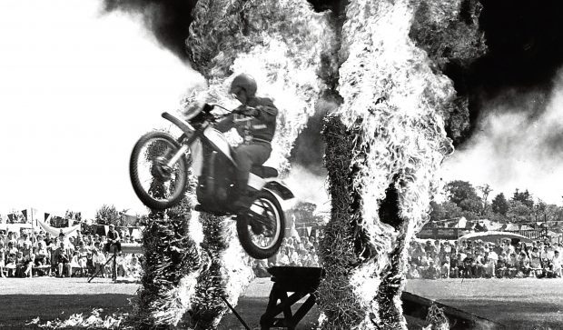 A member of the Blue
Arrows display team
clears burning straw.