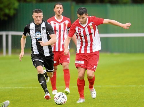 Calum Dingwall in action for Formartine, right.