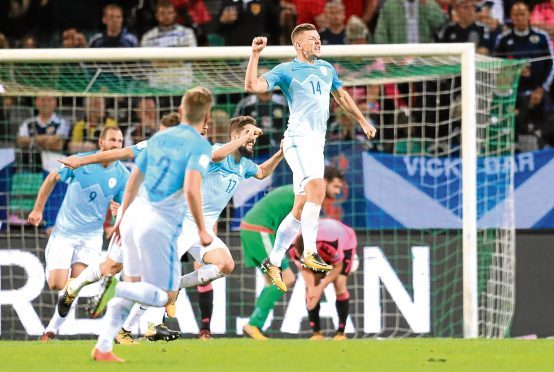 Slovenia's Roman Bezjac celebrates scoring his side's second goal of the game during the 2018 FIFA World Cup Qualifying Group F match at Stadion Stozice, Ljubljana. PRESS ASSOCIATION Photo. Picture date: Sunday October 8, 2017. See PA story SOCCER Scotland. Photo credit should read: Adam Davy/PA Wire. RESTRICTIONS: Use subject to restrictions. Editorial use only. Commercial use only with prior written consent of the Scottish FA