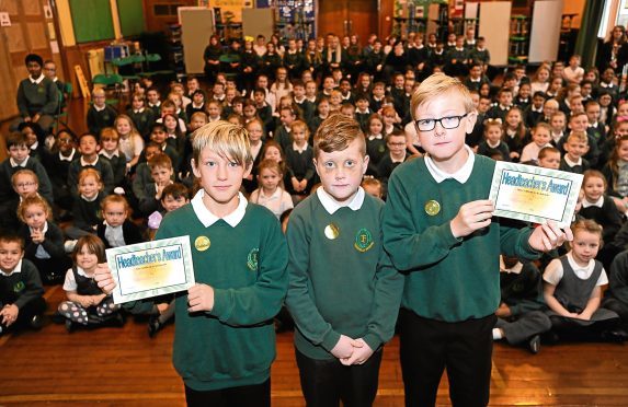 Pictured are Fernielea School pupils from left, Bradley Chalmers, 11, Tyler Hood, 10 and Jac Banks, 11 in front of their whole school at a special assembly.
