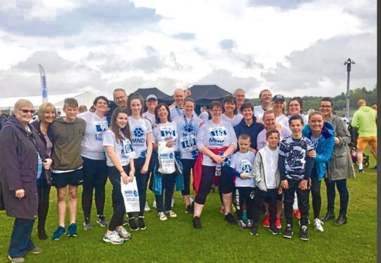 Graeme with family and friends who took part in the MND Scotland Fun Run to raise funds for research into the condition.