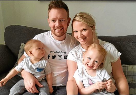 Michael with his wife Ruth and two children Arran and Alba