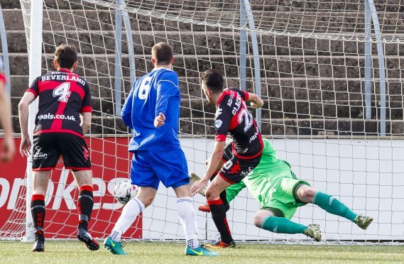 Crusaders Jamie Clackin (20) scores to make it 2-0.