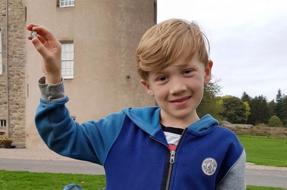 Sonny Crighton with the half sixpence found at Castle Fraser