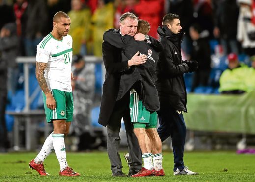 Michael O'Neill, centre, holds Kennedy's international fate in his hands.