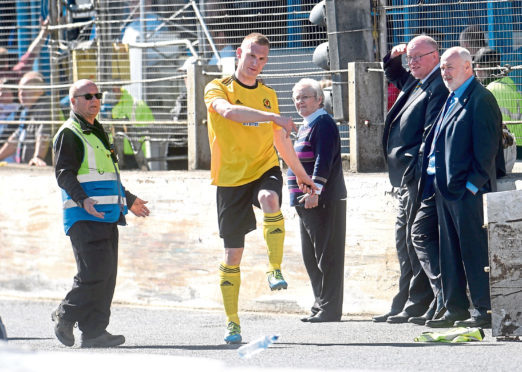 Cove captain Eric Watson kicking out after being sent off.
Picture by Darrell Benns