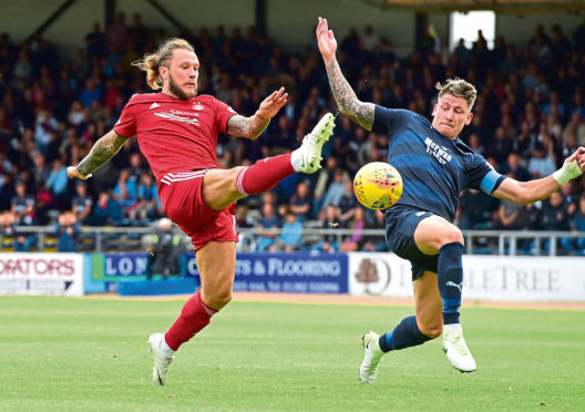Aberden's Stevie May (left) and Josh Meetings in action.