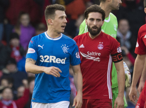 Rangers' Ryan Jack is led away by Aberdeen's Graeme Shinnie after he is sent off last season.