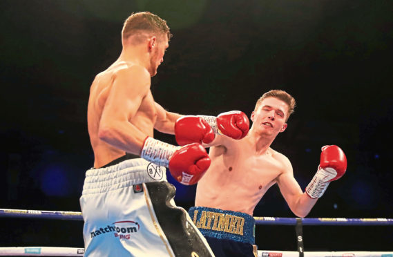 John Docherty knocks down Jordan Latimer during a super-bantamweight contest at Metro Radio Arena on October 13, 2018 in Newcastle upon Tyne, England.