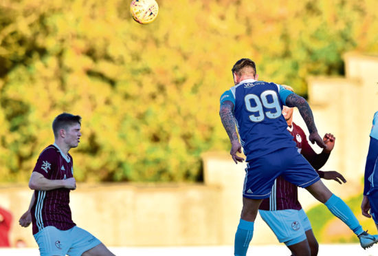 Derek Lyle scores the Blue Toon's third.