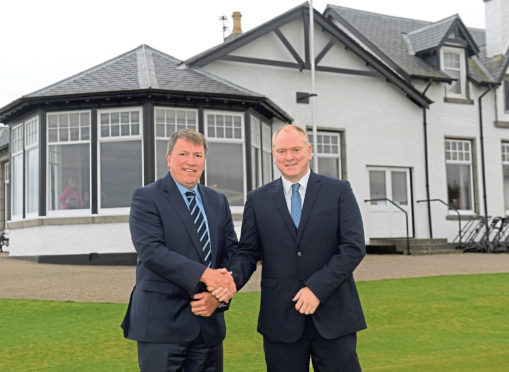 From left, Shaun George welcomes new appointment Keith Grant.
Picture by Kath Flannery