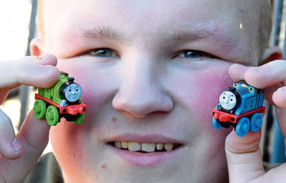 Pictured is Liam McIntyre with sone of his collection of Thomas the Tank Engine trains