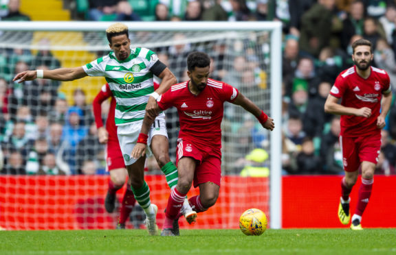 Celtic's Scott Sinclair, left, competes with Aberdeen's Shay Logan.