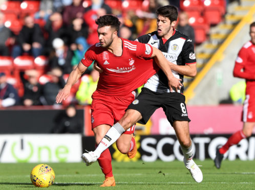 St Mirren's Ryan Flynn challenges Connor McLennan.