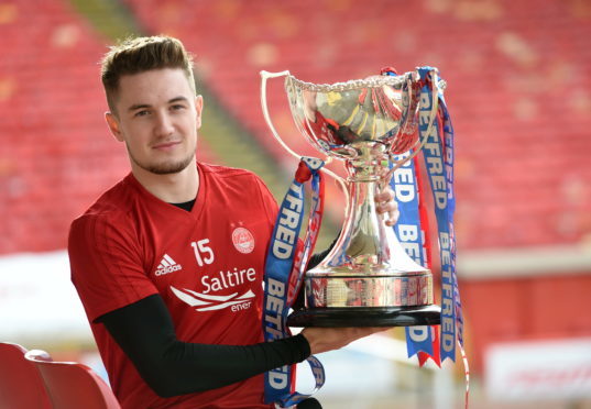 Scott Wright with the Betfred Cup.
Picture by Darrell Benns